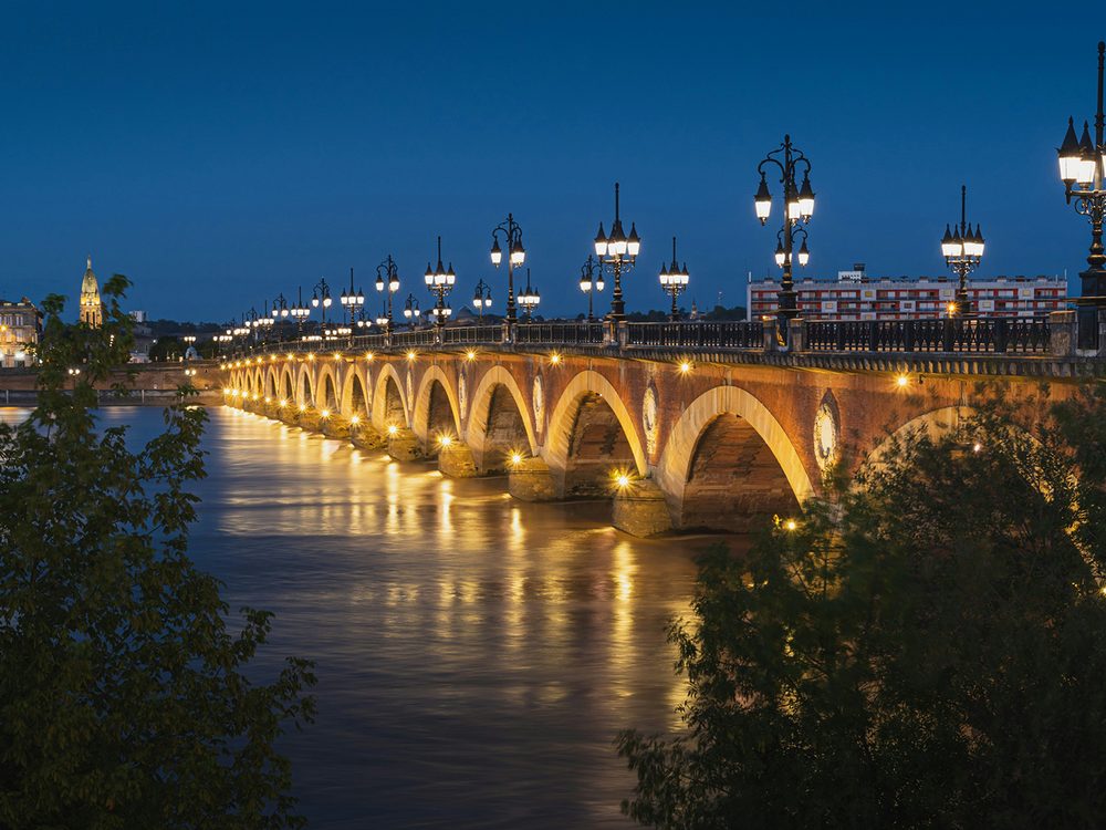 The Pont de Pierre over the Garonne in Bordeaux at night